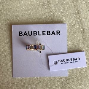 I wear a size 6-7 and this fits as a size 6.5. Never worn. Costume Jewelry